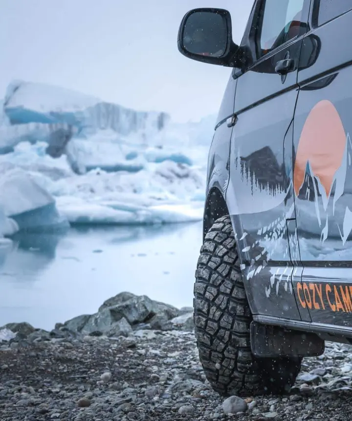 A Cozy Campers camper by the icebergs of Jökulsárlón glacier lagoon