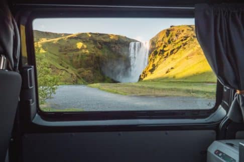 A view out the window of a cozy camper