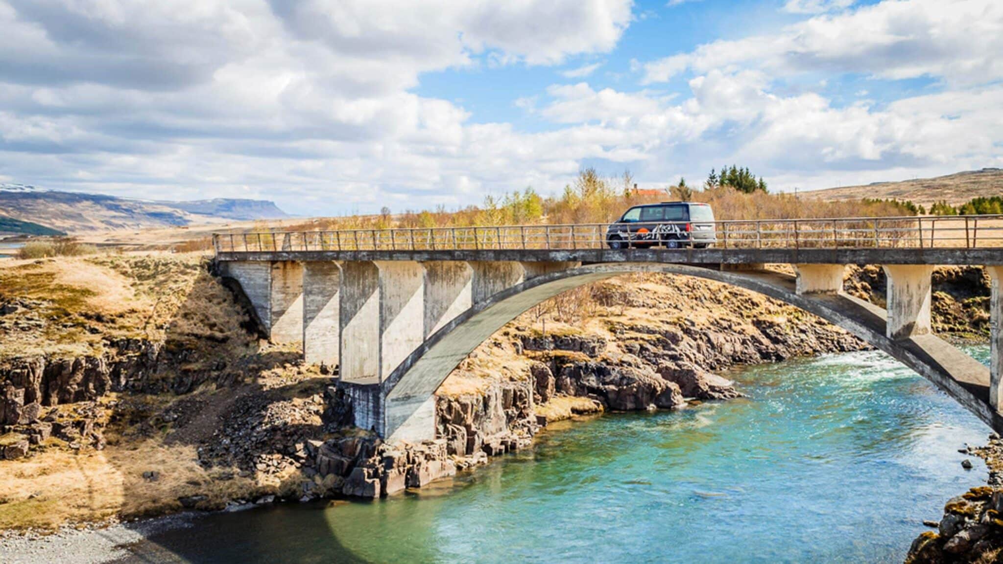 camper on bridge in Iceland