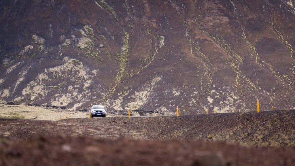 car driving on abandoned road Iceland