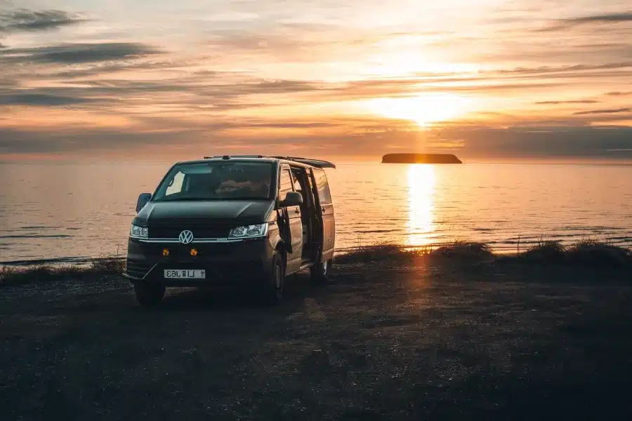 Cozy Camper Van on the coast of Iceland during the long days of summer.