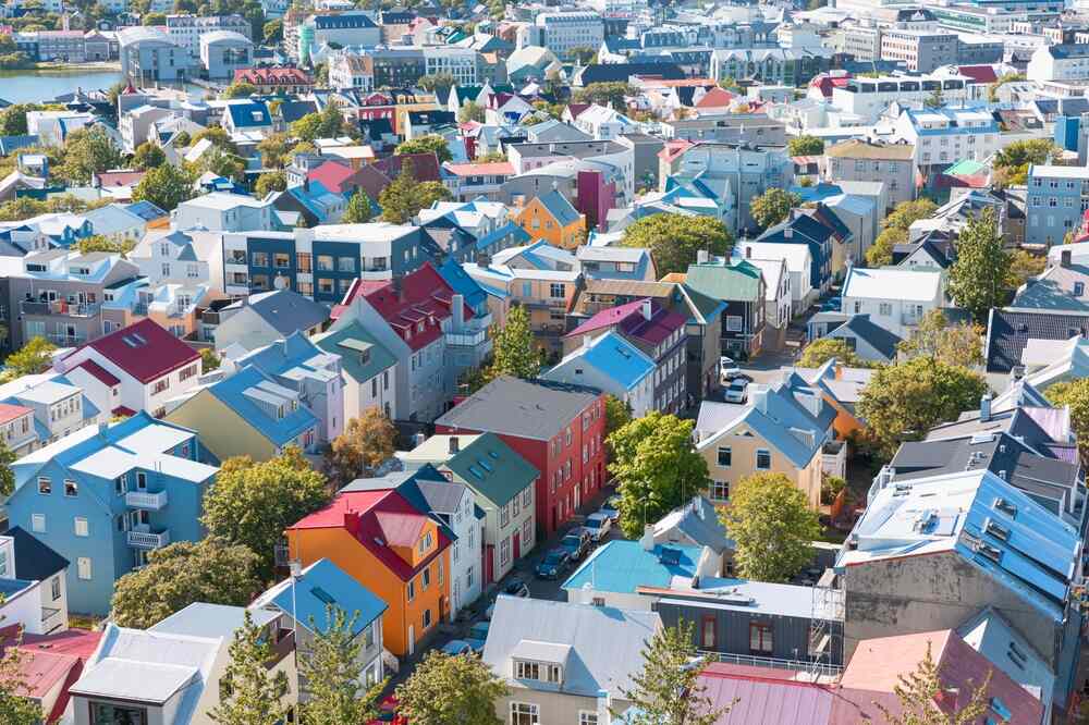 Colorful homes fill the frame in an elevated view of a Reykjavik neighborhood. 