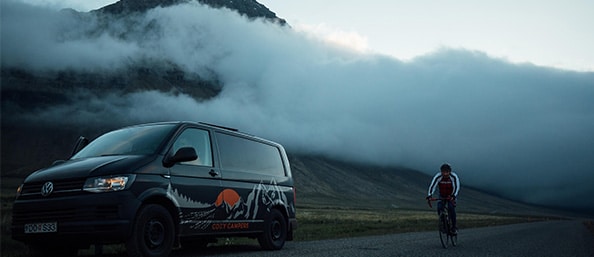 Cozy Camper Van and Biker on the roads of Iceland